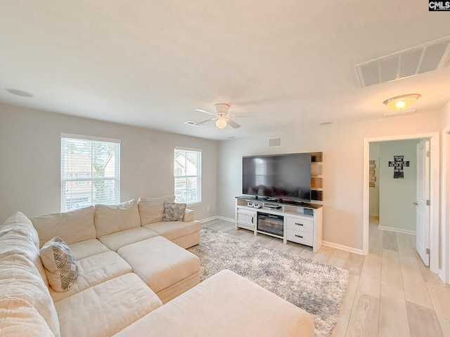 121 Ashford Way, Lexington, SC 29072 - living room featuring baseboards, a ceiling fan, and light wood-style flooring