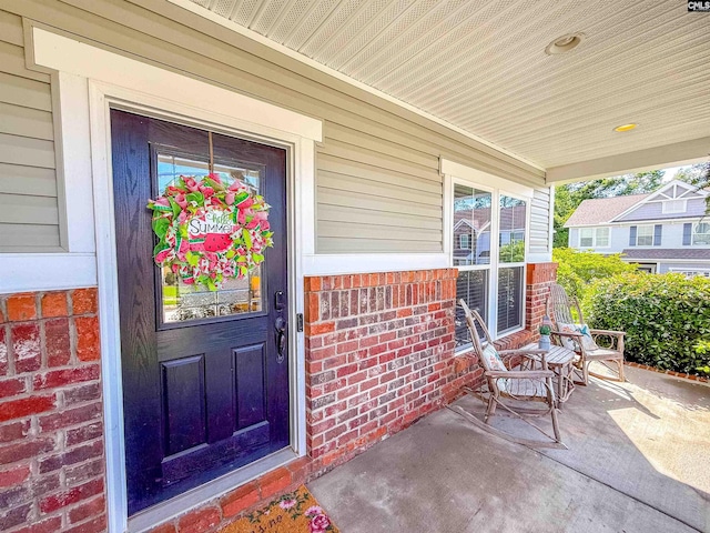 121 Ashford Way, Lexington, SC 29072 - doorway to property featuring covered porch and brick siding