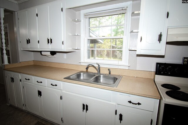 5199 Bethune Rd, Kershaw, SC 29067 - kitchen with electric stove, open shelves, a sink, and white cabinetry