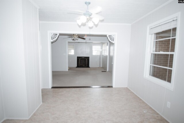 5199 Bethune Rd, Kershaw, SC 29067 - unfurnished room featuring ornamental molding, a ceiling fan, and a fireplace