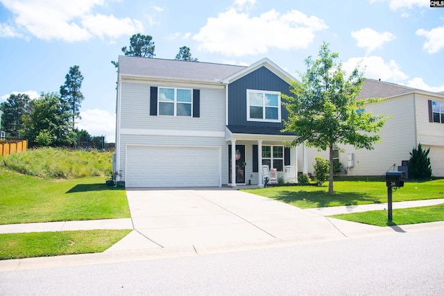 268 Drooping Leaf Rd, Lexington, SC 29072 - traditional home with a garage, driveway, a front yard, board and batten siding, and covered porch