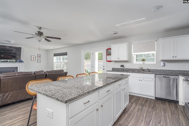 646 Penfolds Way, Blythewood, SC 29016 - kitchen featuring stainless steel appliances, a breakfast bar, a center island, and dark wood finished floors