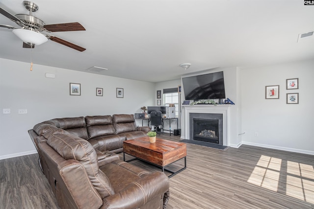 646 Penfolds Way, Blythewood, SC 29016 - living area featuring a ceiling fan, wood finished floors, baseboards, and a glass covered fireplace