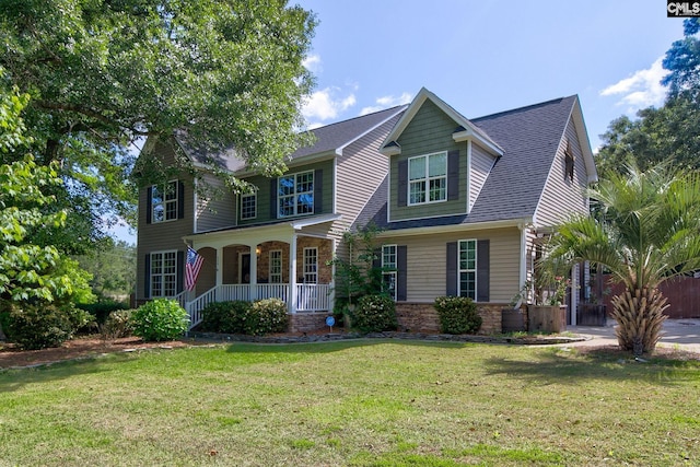220 Pine Grove Rd, Lugoff, SC 29078 - view of front of home featuring covered porch, a front lawn, stone siding, and a shingled roof