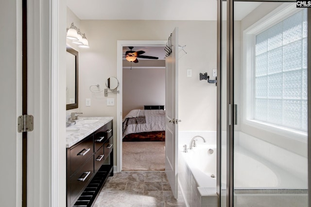 220 Pine Grove Rd, Lugoff, SC 29078 - ensuite bathroom featuring double vanity, a ceiling fan, and a garden tub