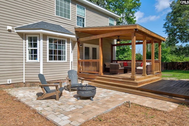 220 Pine Grove Rd, Lugoff, SC 29078 - rear view of house featuring a deck, an outdoor living space with a fire pit, and a patio area