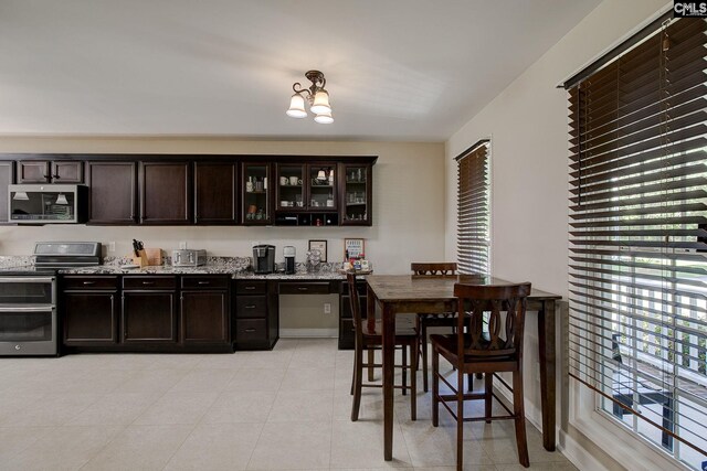 220 Pine Grove Rd, Lugoff, SC 29078 - bar featuring appliances with stainless steel finishes, plenty of natural light, and a chandelier