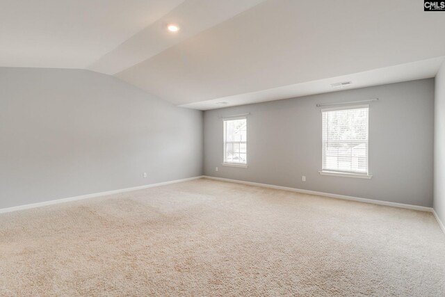 724 Channing Creek Ln, Lexington, SC 29072 - spare room with vaulted ceiling, baseboards, and light colored carpet
