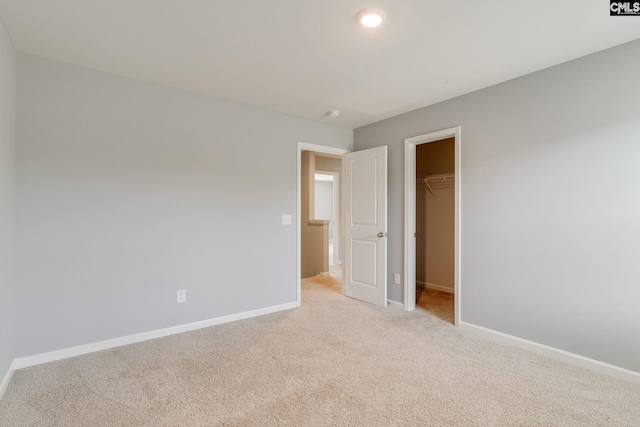 724 Channing Creek Ln, Lexington, SC 29072 - unfurnished bedroom featuring light colored carpet, baseboards, a spacious closet, and a closet