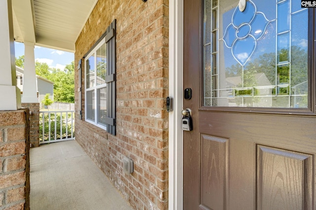 724 Channing Creek Ln, Lexington, SC 29072 - doorway to property featuring a porch and brick siding