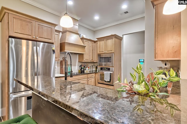 117 Shoal Creek Ln, Blythewood, SC 29016 - kitchen with stainless steel appliances, premium range hood, light brown cabinets, crown molding, and dark stone countertops
