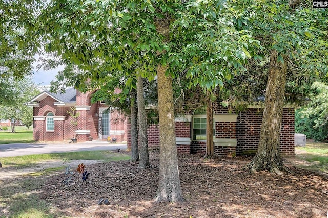 117 Shoal Creek Ln, Blythewood, SC 29016 - view of front of property featuring brick siding, central AC unit, and a chimney