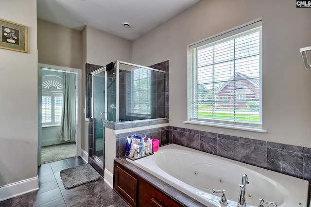 117 Shoal Creek Ln, Blythewood, SC 29016 - full bath with a shower stall, a tub with jets, tile patterned floors, and baseboards