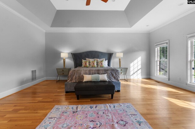 279 Canterwood Rd, Irmo, SC 29063 - bedroom featuring a tray ceiling, wood finished floors, crown molding, baseboards, and a ceiling fan