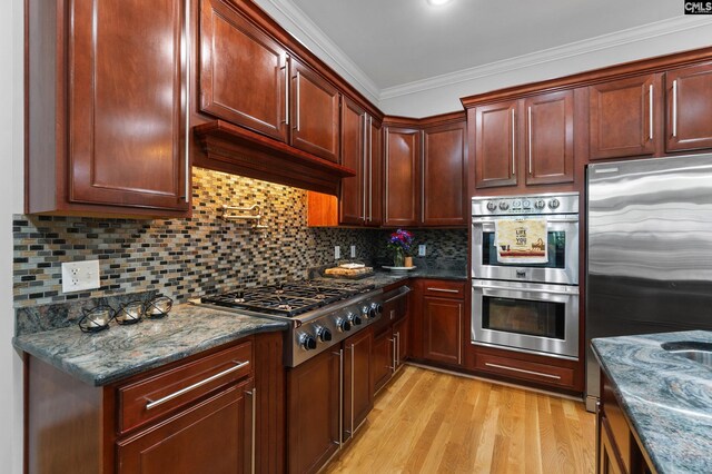 279 Canterwood Rd, Irmo, SC 29063 - kitchen featuring stainless steel appliances, ornamental molding, light wood-type flooring, backsplash, and dark stone counters