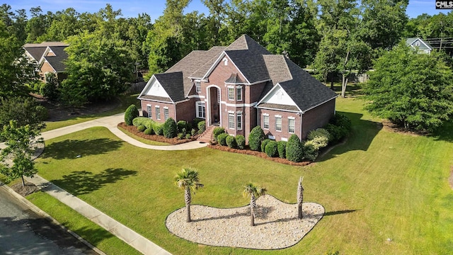 279 Canterwood Rd, Irmo, SC 29063 - view of front of home featuring brick siding, a front lawn, a shingled roof, and view of wooded area