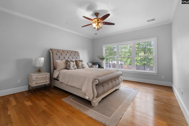 279 Canterwood Rd, Irmo, SC 29063 - bedroom with baseboards, wood finished floors, ornamental molding, and a ceiling fan