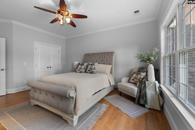 279 Canterwood Rd, Irmo, SC 29063 - bedroom with wood finished floors, multiple windows, ornamental molding, ceiling fan, and baseboards