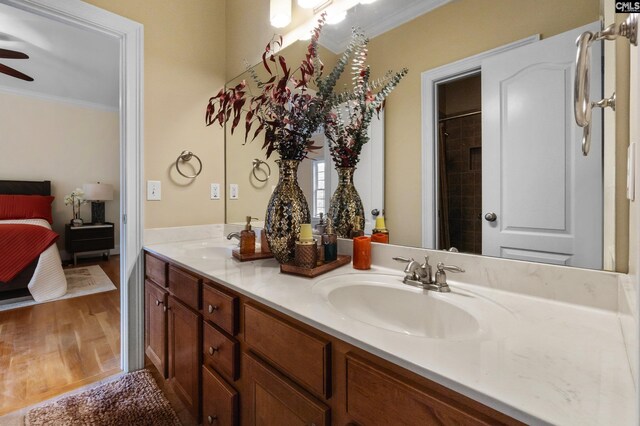 279 Canterwood Rd, Irmo, SC 29063 - ensuite bathroom with ornamental molding, double vanity, ceiling fan, and wood finished floors