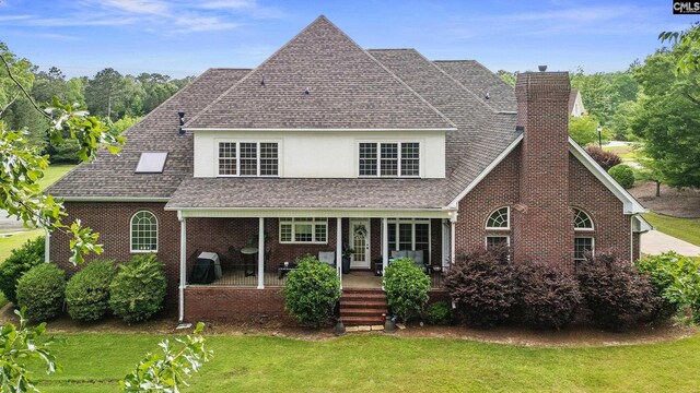 279 Canterwood Rd, Irmo, SC 29063 - back of property featuring a shingled roof, a yard, a chimney, and brick siding
