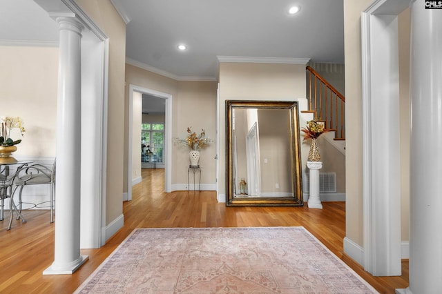 279 Canterwood Rd, Irmo, SC 29063 - foyer featuring decorative columns, wood finished floors, ornamental molding, stairs, and recessed lighting