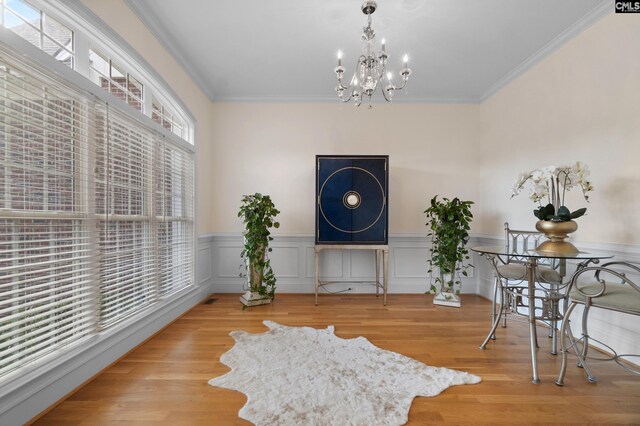 279 Canterwood Rd, Irmo, SC 29063 - living area featuring a chandelier, wainscoting, crown molding, and wood finished floors