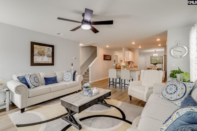 637 Penfolds Way, Blythewood, SC 29016 - living area featuring light wood-type flooring, stairway, a ceiling fan, recessed lighting, and baseboards