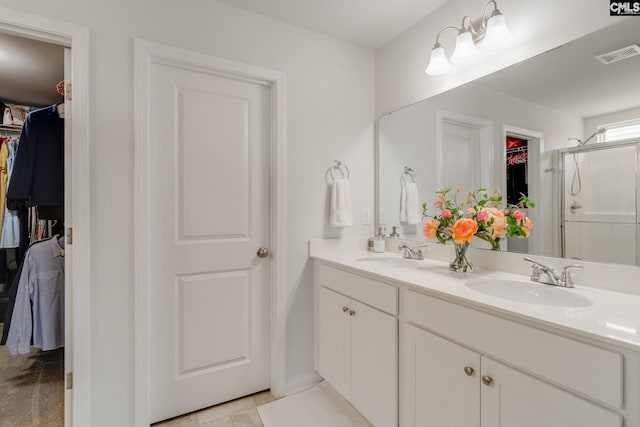 637 Penfolds Way, Blythewood, SC 29016 - full bathroom featuring a walk in closet, double vanity, a shower stall, and baseboards