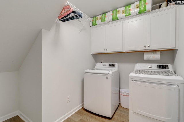 637 Penfolds Way, Blythewood, SC 29016 - laundry area with washing machine and dryer, cabinet space, light wood-style flooring, and baseboards