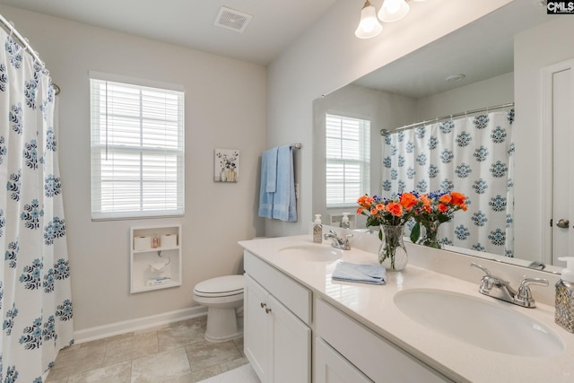 637 Penfolds Way, Blythewood, SC 29016 - bathroom featuring toilet, healthy amount of natural light, double vanity, and baseboards