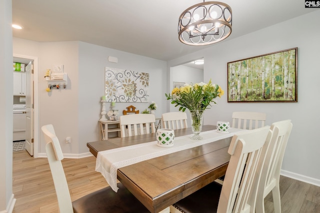 637 Penfolds Way, Blythewood, SC 29016 - dining room with light wood-style flooring, a chandelier, and baseboards