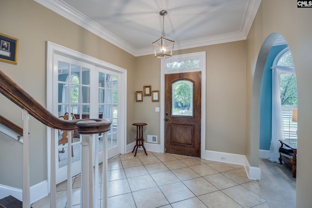 616 Brandon Ct, Lexington, SC 29072 - entrance foyer with arched walkways, crown molding, baseboards, a chandelier, and light tile patterned floors