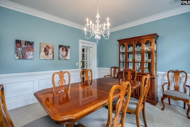 616 Brandon Ct, Lexington, SC 29072 - dining area featuring carpet flooring, a chandelier, ornamental molding, a wainscoted wall, and a decorative wall