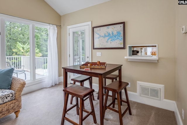 616 Brandon Ct, Lexington, SC 29072 - dining room featuring plenty of natural light, lofted ceiling, carpet flooring, and baseboards