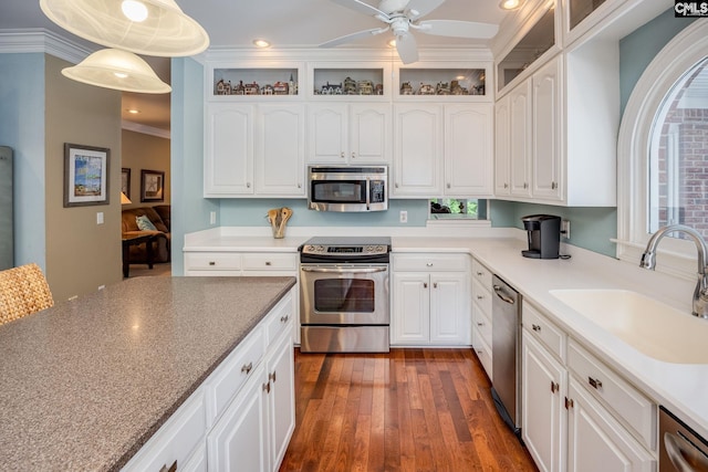 616 Brandon Ct, Lexington, SC 29072 - kitchen featuring appliances with stainless steel finishes, a sink, white cabinetry, dark wood finished floors, and recessed lighting