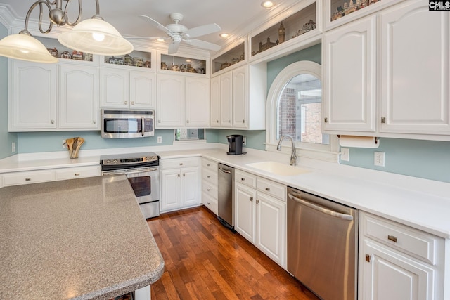 616 Brandon Ct, Lexington, SC 29072 - kitchen featuring appliances with stainless steel finishes, a sink, white cabinetry, recessed lighting, and glass insert cabinets