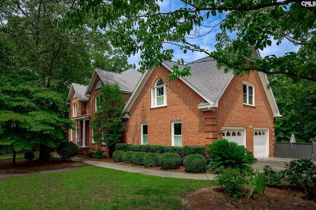 616 Brandon Ct, Lexington, SC 29072 - traditional home with brick siding, roof with shingles, a garage, and concrete driveway