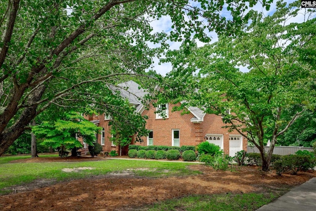 616 Brandon Ct, Lexington, SC 29072 - view of front facade with brick siding, an attached garage, and a front lawn