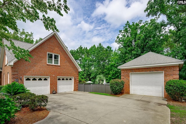 616 Brandon Ct, Lexington, SC 29072 - view of side of home featuring brick siding, a shingled roof, and concrete driveway