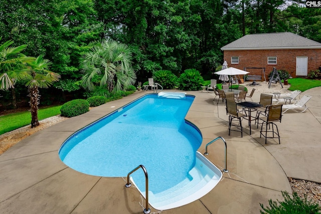 616 Brandon Ct, Lexington, SC 29072 - swimming pool with a patio area and view of scattered trees