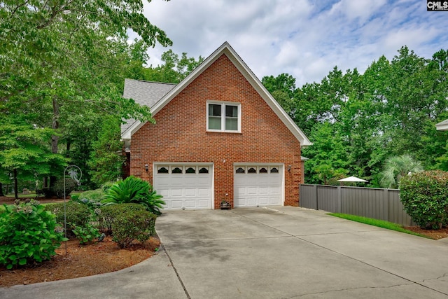 616 Brandon Ct, Lexington, SC 29072 - view of home's exterior with brick siding, driveway, a garage, and roof with shingles