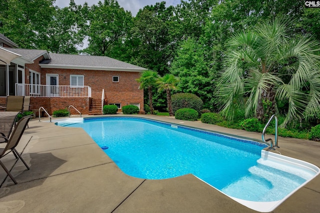 616 Brandon Ct, Lexington, SC 29072 - swimming pool featuring a patio, stairs, and view of scattered trees