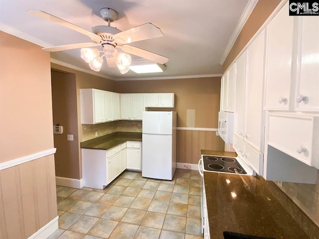 2825 Pruitt Dr, Columbia, SC 29204 - kitchen featuring white appliances, a ceiling fan, dark countertops, white cabinetry, and wainscoting