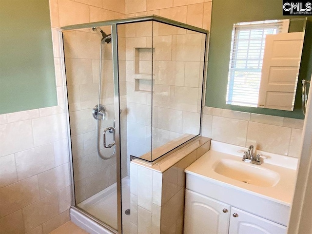2825 Pruitt Dr, Columbia, SC 29204 - full bath featuring tile walls, a shower stall, and vanity