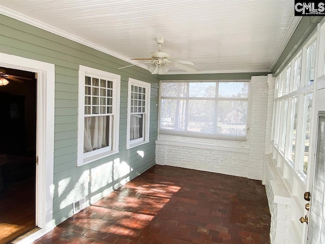2825 Pruitt Dr, Columbia, SC 29204 - unfurnished sunroom with brick floors, crown molding, and wooden walls