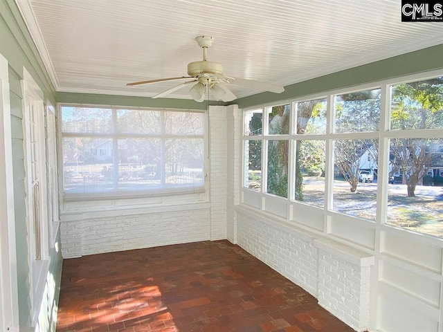 2825 Pruitt Dr, Columbia, SC 29204 - unfurnished sunroom featuring brick flooring and brick wall