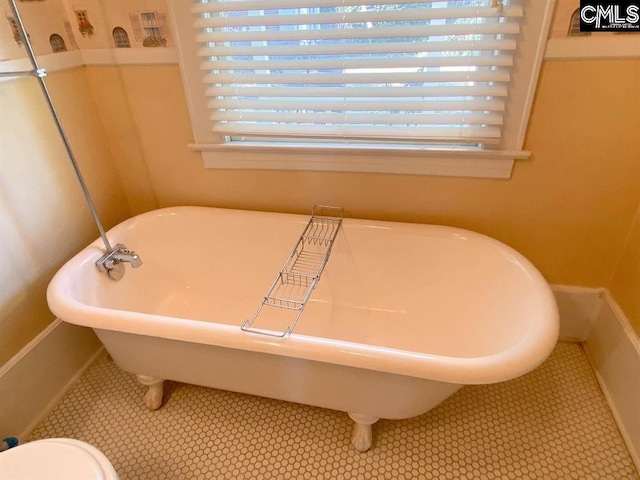 2825 Pruitt Dr, Columbia, SC 29204 - bathroom with a freestanding tub and tile patterned floors