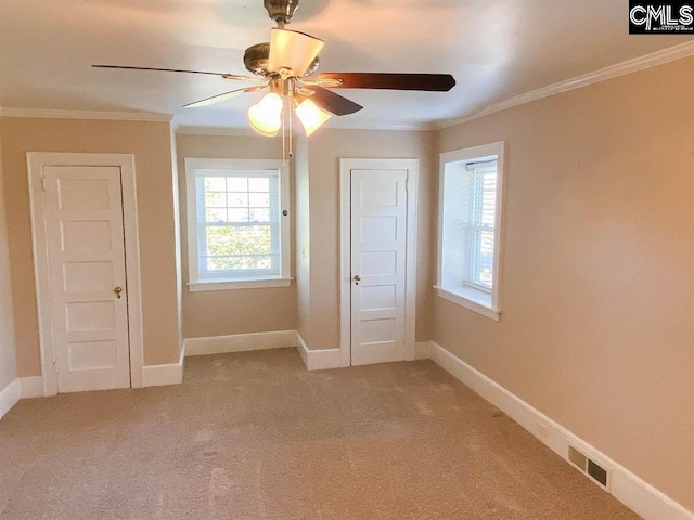 2825 Pruitt Dr, Columbia, SC 29204 - empty room featuring light carpet, crown molding, ceiling fan, and baseboards