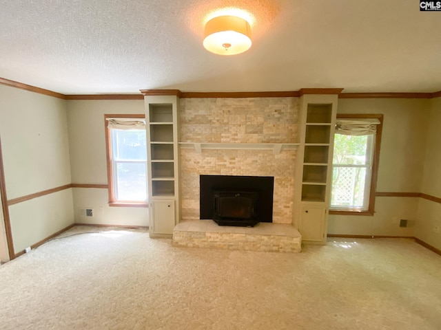 141 Runneymede Dr, Blythewood, SC 29016 - unfurnished living room with healthy amount of natural light, carpet floors, baseboards, a textured ceiling, and crown molding