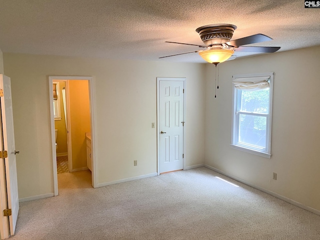 141 Runneymede Dr, Blythewood, SC 29016 - unfurnished bedroom featuring light carpet, a textured ceiling, ceiling fan, and baseboards